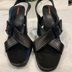 Dark brown Prada strappy sandals.